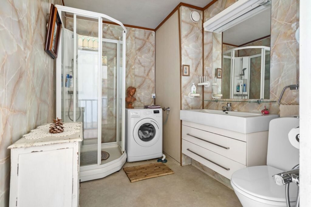 Bright organized bathroom with practical storage and neatly arranged essentials